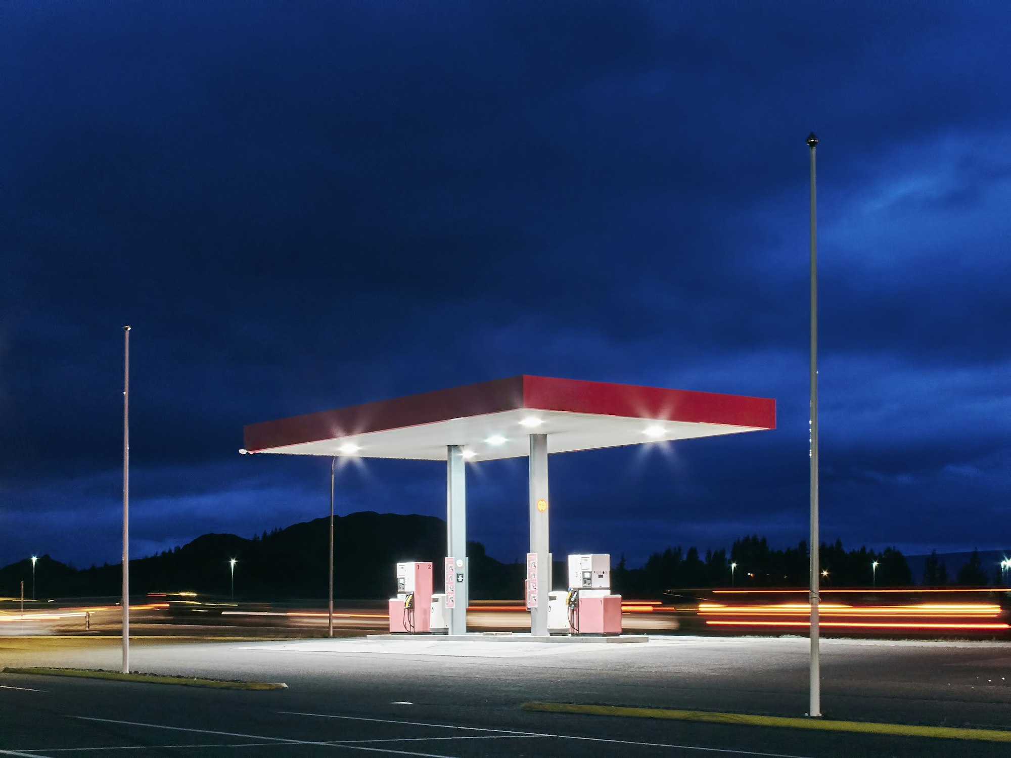 Empty floodlit gas station at night, Hof, Iceland